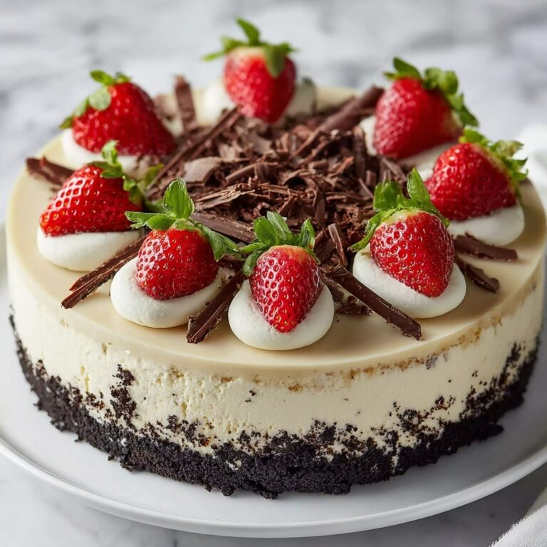 Vanilla Cheesecake with Chocolate Crust and Fresh Strawberry Garnish Recipe
