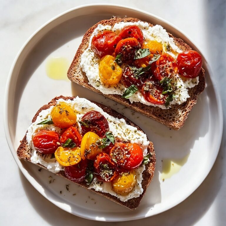 Baked Feta Toast with Cherry Tomatoes and Fresh Basil Recipe