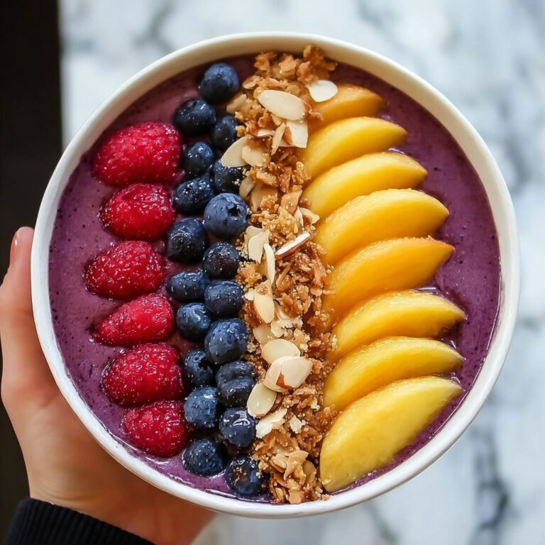 Creamy Acai Bowl with Fresh Fruit and Nut Toppings Recipe